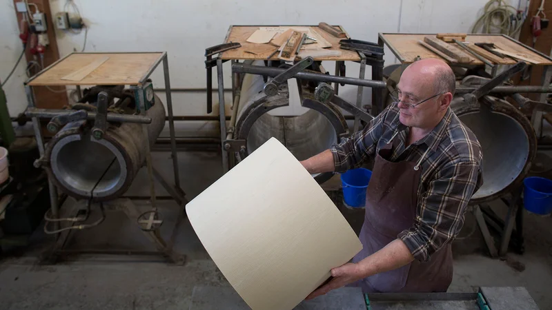 An Expert's Eye: Horst Treude has been working at Sonor since 1980. In the background are the presses where the plywood and veneer panels are glued together to form drum shells.