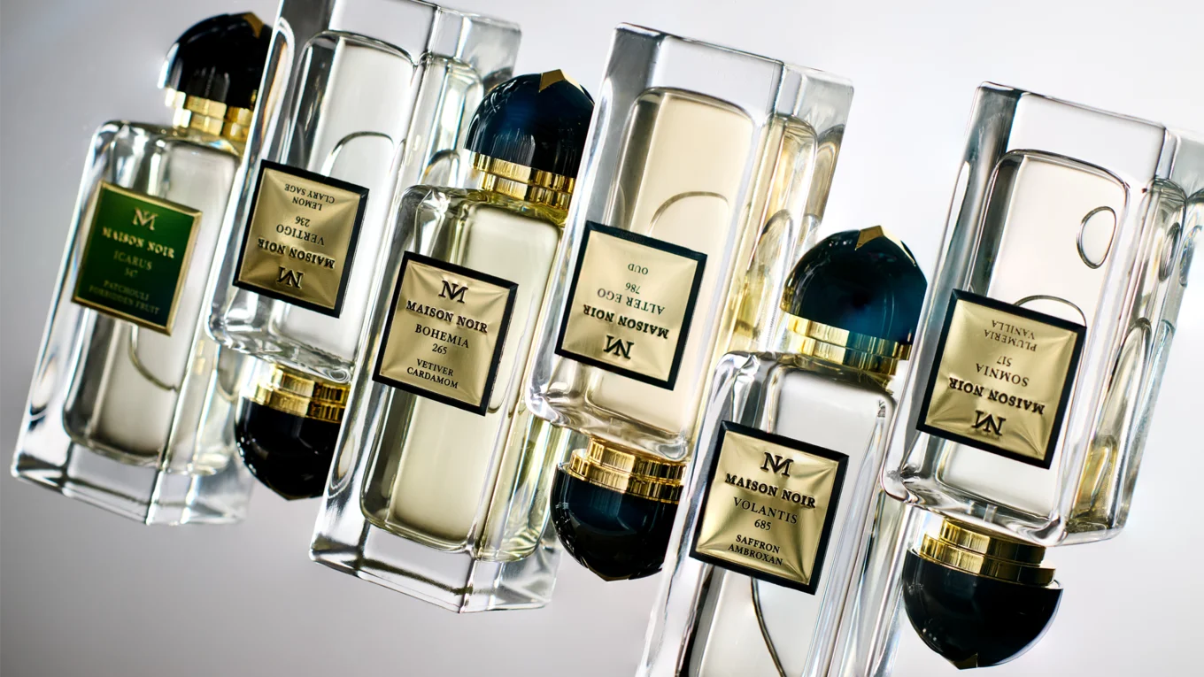 Various Maison Noir perfume bottles with elegant, embossed RATHGEBER aluminum labels.